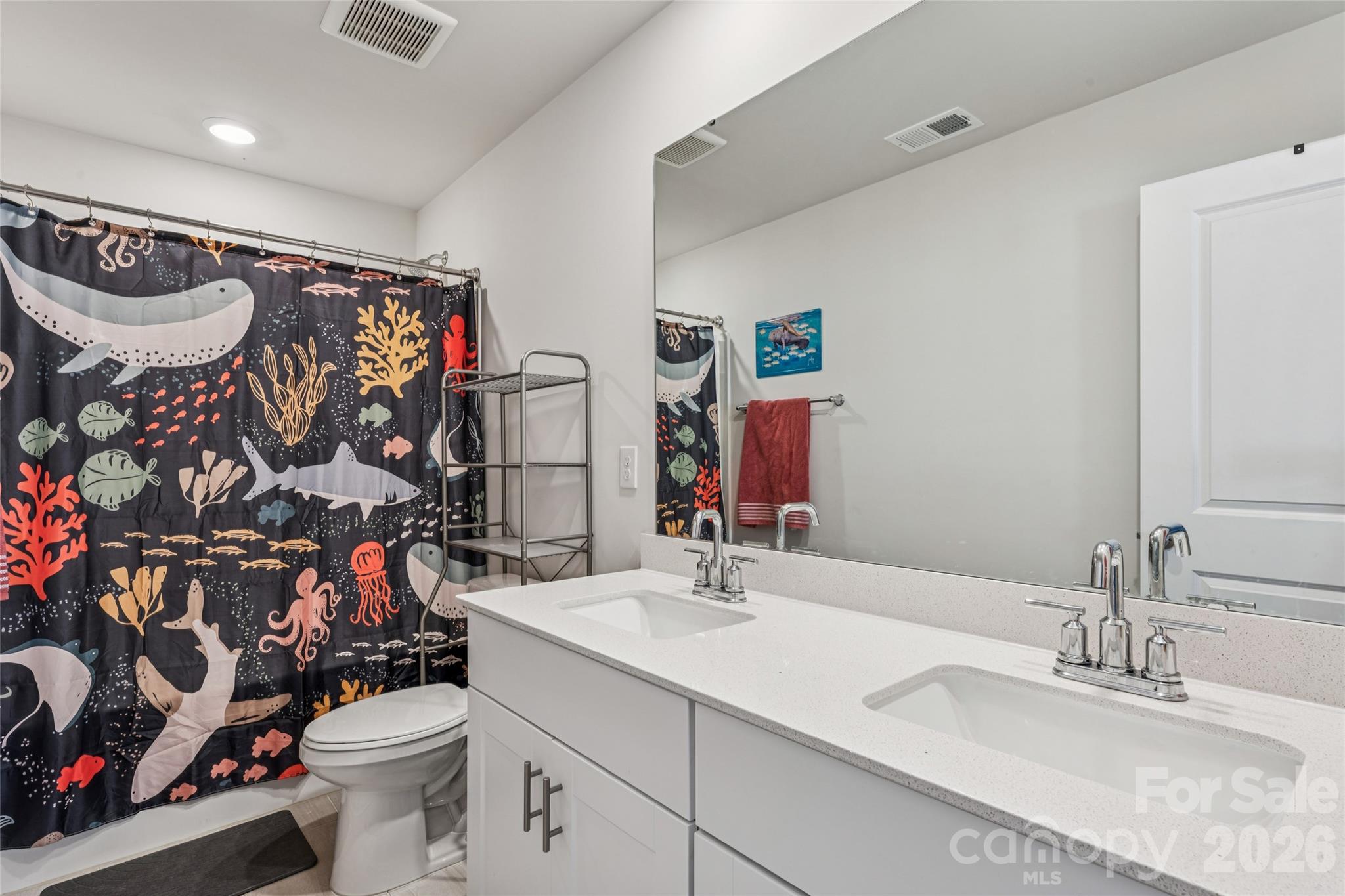 309 Olympia Way York, SC 29745 - Photo 32 of 46 a bathroom with a sink mirror vanity and toilet