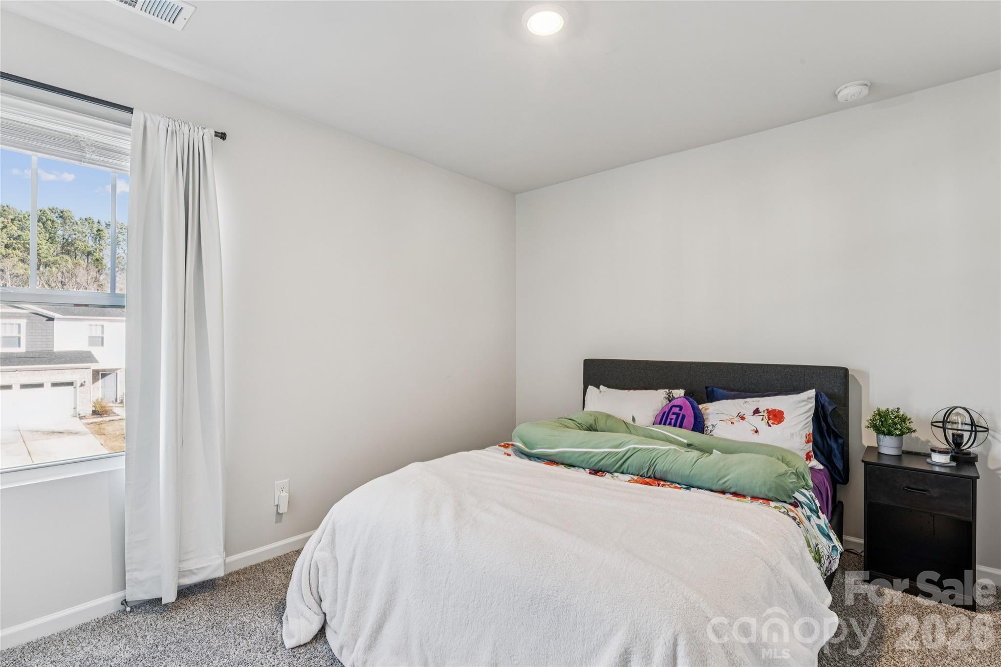 309 Olympia Way York, SC 29745 - Photo 33 of 46 a bedroom with a bed and a window