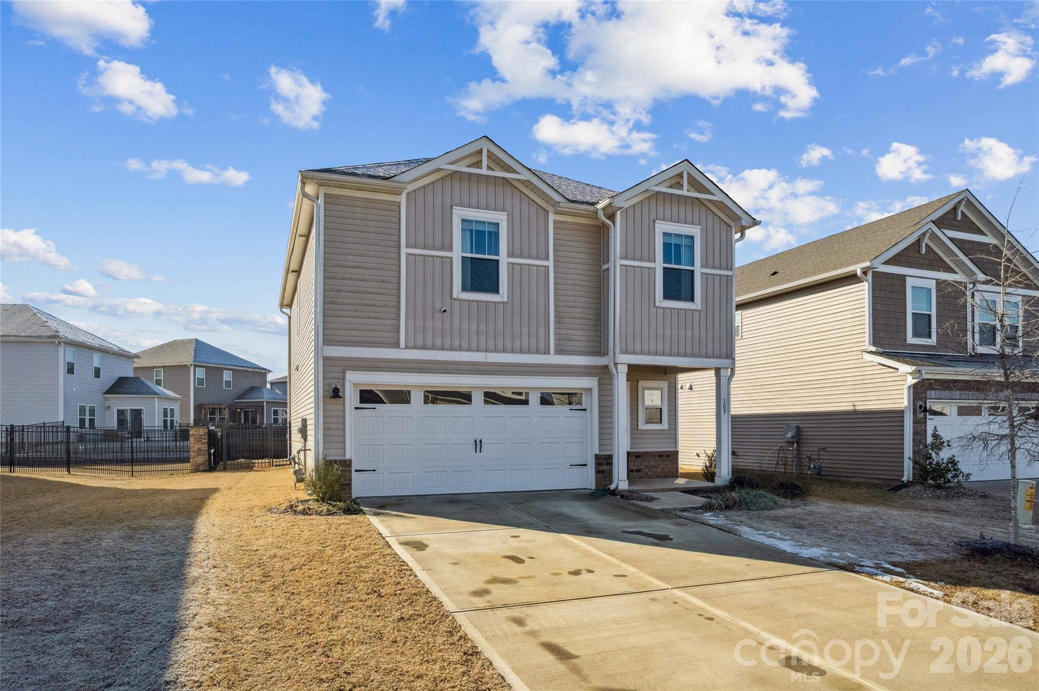 309 Olympia Way York, SC 29745 - Photo 5 of 46 a front view of a house with a yard