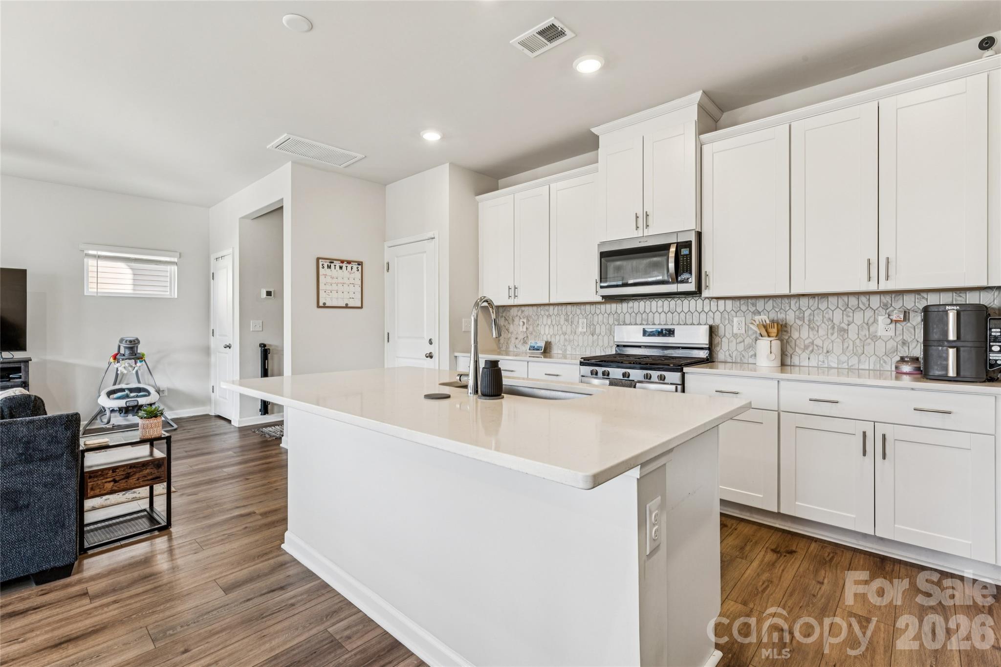 309 Olympia Way York, SC 29745 - Photo 9 of 46 a kitchen with appliances a sink and cabinets