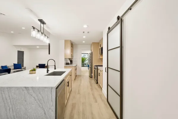 a kitchen with counter top space and a sink