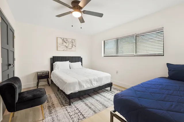 a bedroom with a bed and a couch