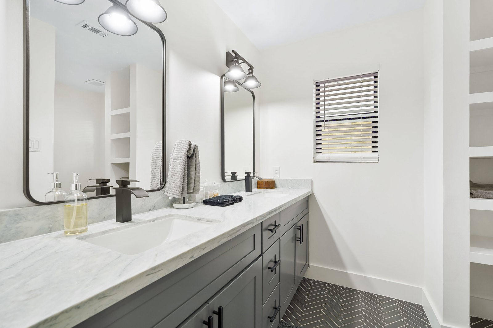 3327 Freshmeadows Drive Houston, TX 77063 - Photo 20 of 35 a bathroom with a double vanity sink and a mirror