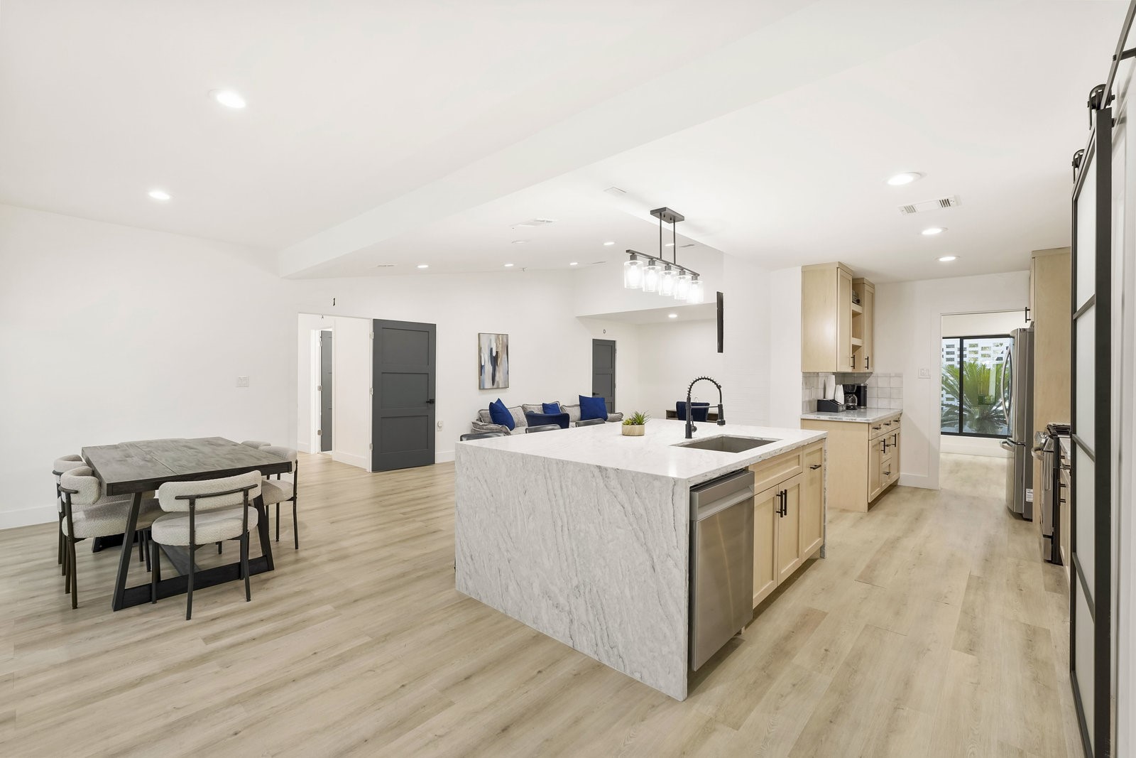 3327 Freshmeadows Drive Houston, TX 77063 - Photo 2 of 35 a large white kitchen with wooden floor and a sink
