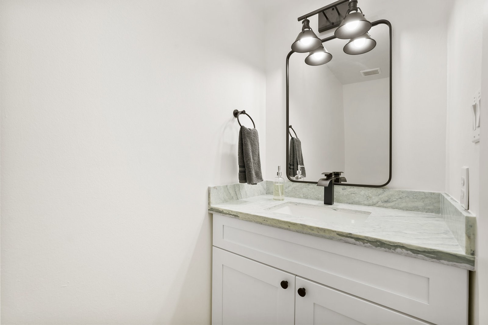 3327 Freshmeadows Drive Houston, TX 77063 - Photo 23 of 35 a bathroom with a sink and mirror