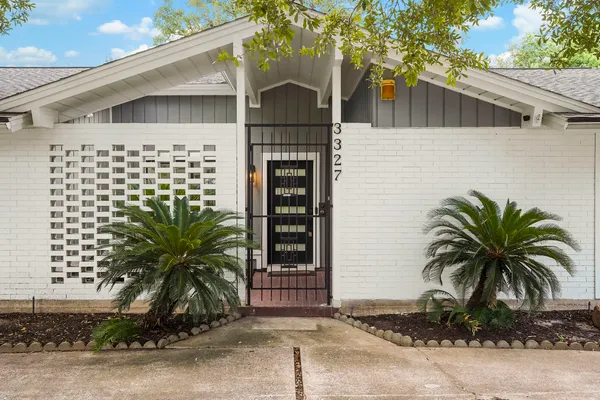 a front view of a house with garage