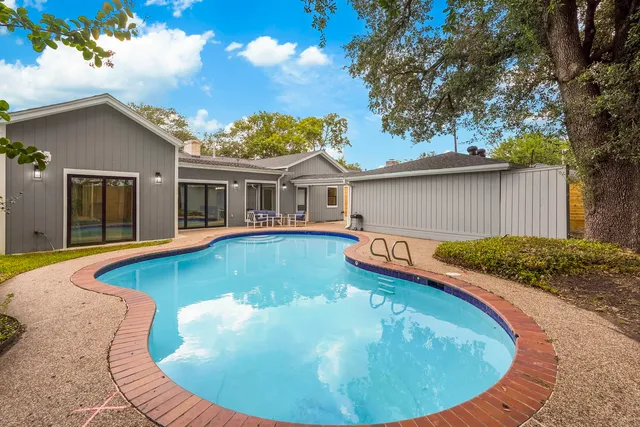 a view of a house with swimming pool