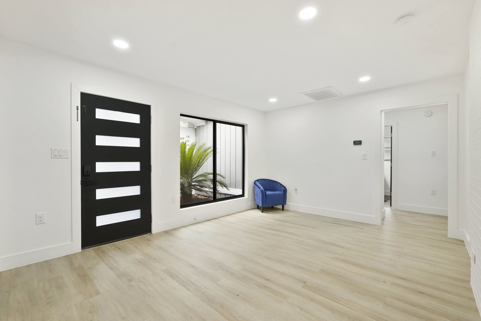 3327 Freshmeadows Drive Houston, TX 77063 - Photo 6 of 35 wooden floor in an empty room with a window