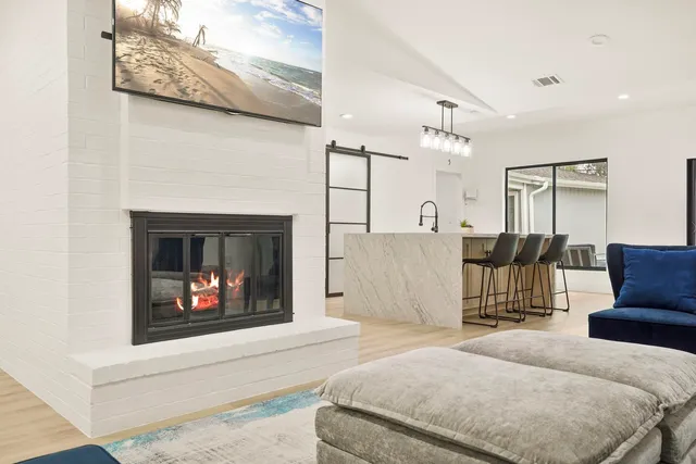 a bedroom with a bed and a fireplace