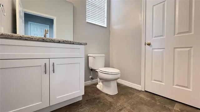 a bathroom with a toilet and a sink