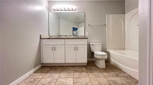 a view of a room with shelves on the wall