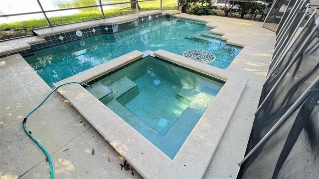 a view of a swimming pool with a patio