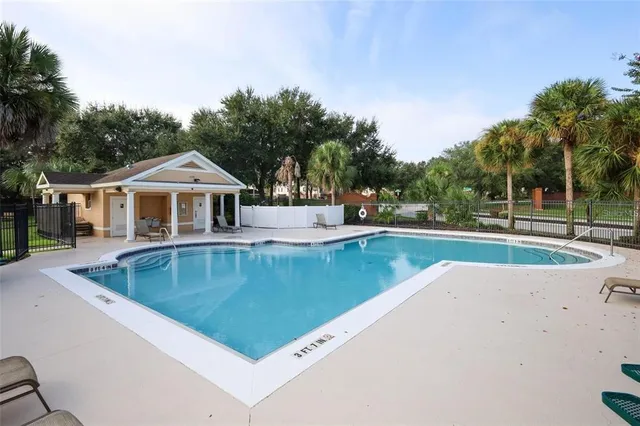 a house view with a sitting space and garden