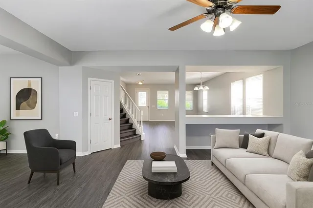 a living room with furniture and a large window
