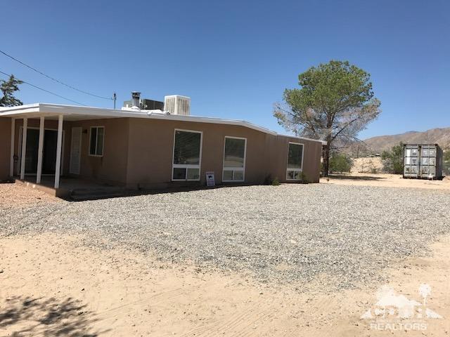 8856 Little Morongo Road Morongo Valley, CA 92256 - Photo 2 of 37 a view of a house with a snow in the yard