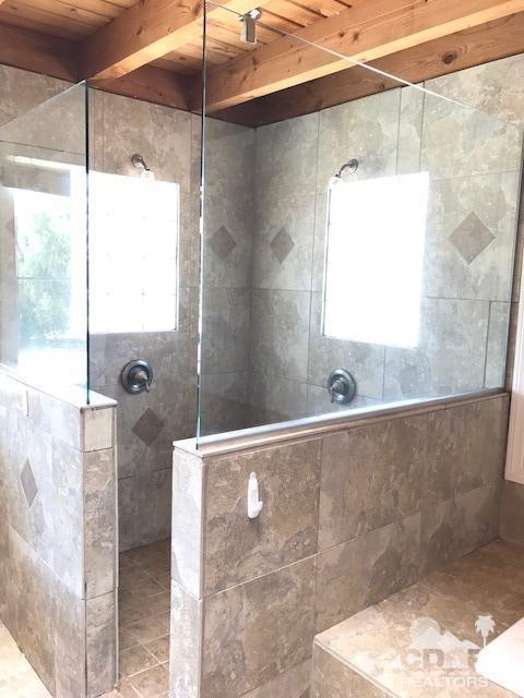 8856 Little Morongo Road Morongo Valley, CA 92256 - Photo 36 of 37 a bathroom with a bathtub and shower