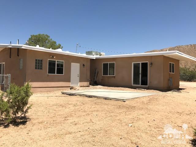 8856 Little Morongo Road Morongo Valley, CA 92256 - Photo 5 of 37 a view of a house with a yard