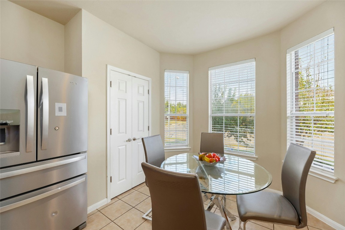 18401 Masi Loop Pflugerville, TX 78660 - Photo 11 of 29 Dining room with light tile patterned floors and plenty of natural light
