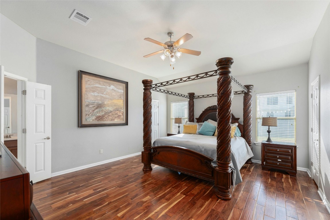 18401 Masi Loop Pflugerville, TX 78660 - Photo 14 of 29 Bedroom featuring hardwood / wood-style floors and a ceiling fan