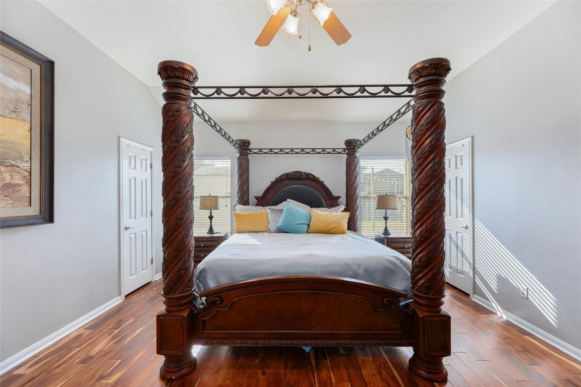 18401 Masi Loop Pflugerville, TX 78660 - Photo 15 of 29 Bedroom with hardwood / wood-style flooring and ceiling fan