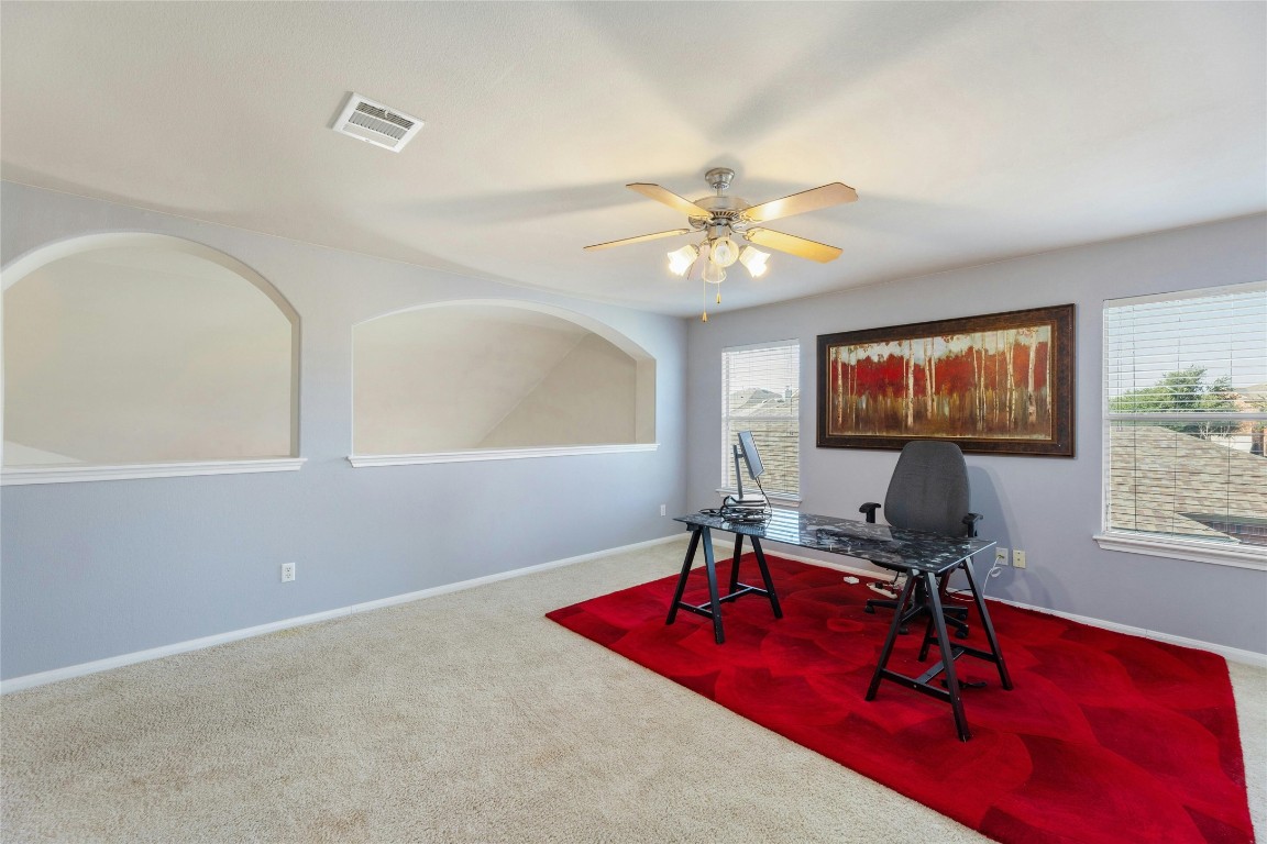 18401 Masi Loop Pflugerville, TX 78660 - Photo 20 of 29 Carpeted home office featuring ceiling fan and baseboards