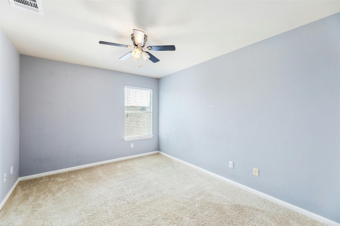 18401 Masi Loop Pflugerville, TX 78660 - Photo 24 of 29 Spare room featuring ceiling fan and carpet floors