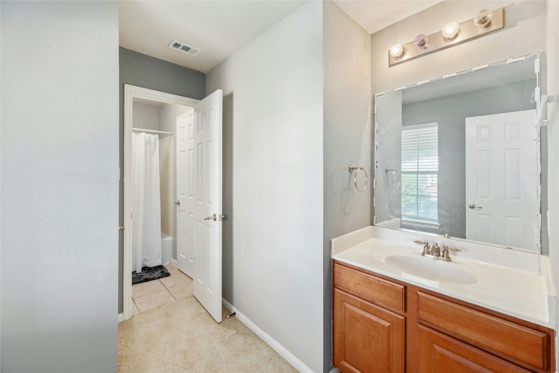 18401 Masi Loop Pflugerville, TX 78660 - Photo 25 of 29 Full bathroom featuring vanity and tile patterned flooring