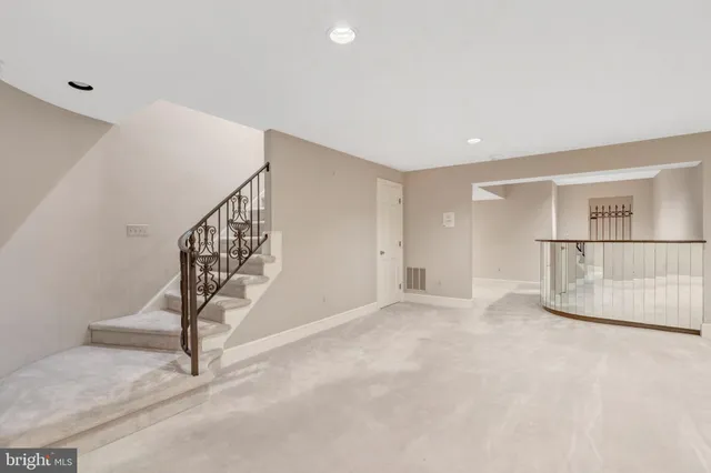 a view of empty room with stairs