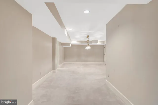 a view of empty room with fireplace