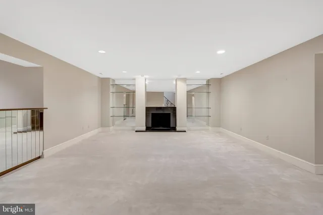a kitchen with granite countertop white cabinets and a stove