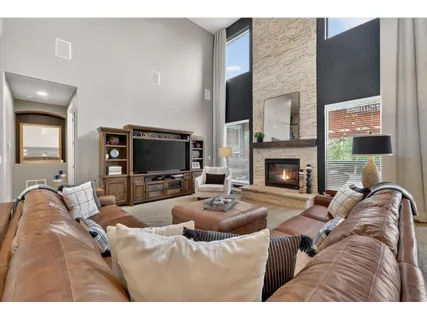 a kitchen with stainless steel appliances kitchen island granite countertop a refrigerator and a stove top oven