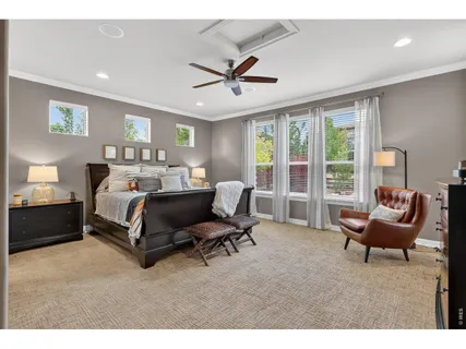 a picture of a living room with a baby crib