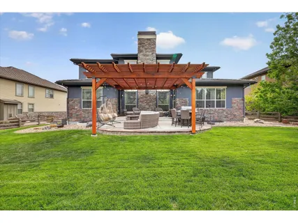 a view of a swimming pool with an outdoor space and seating area