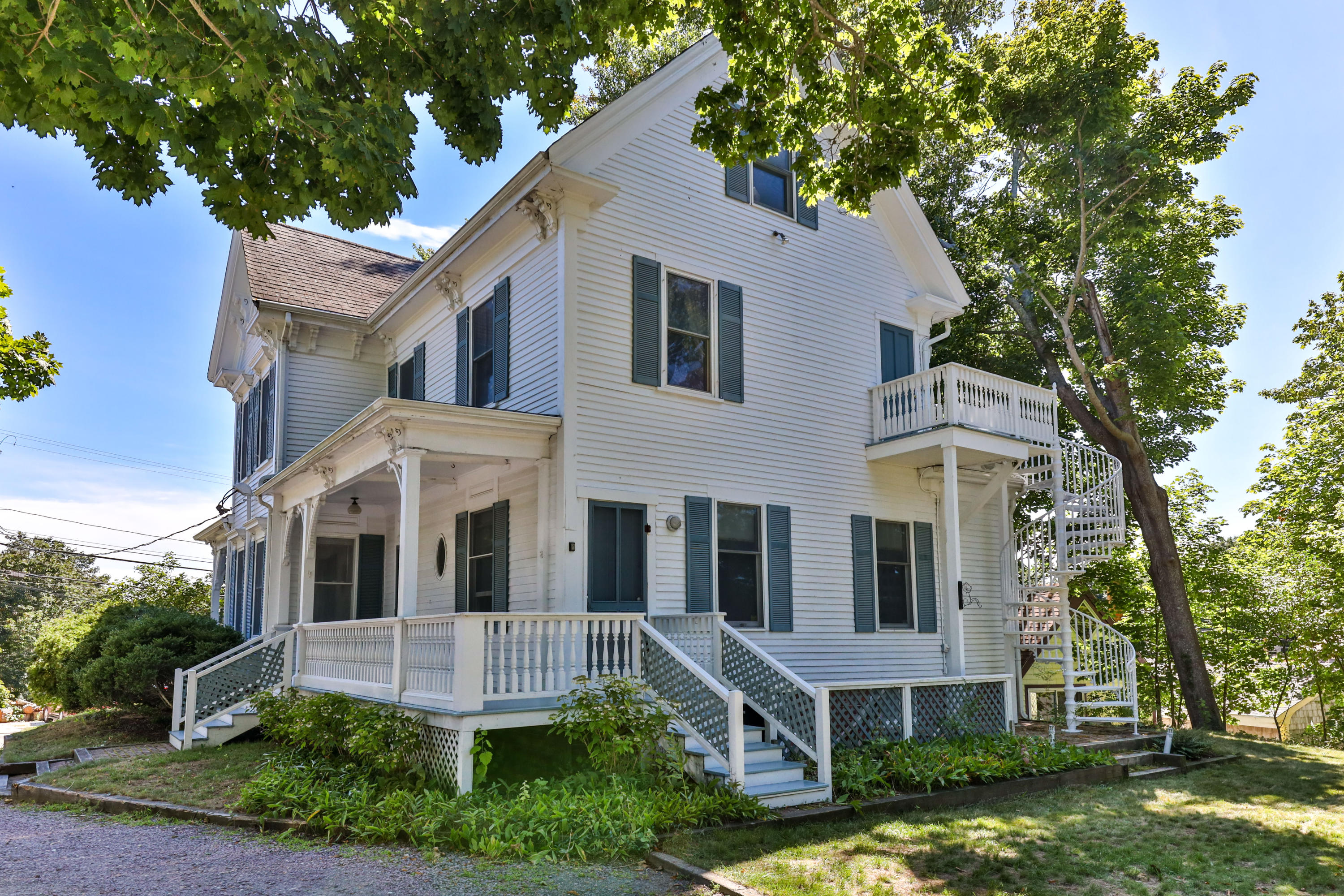 276 Main Street Wellfleet, MA 02667 - Photo 1 of 69 a front view of a house with a yard