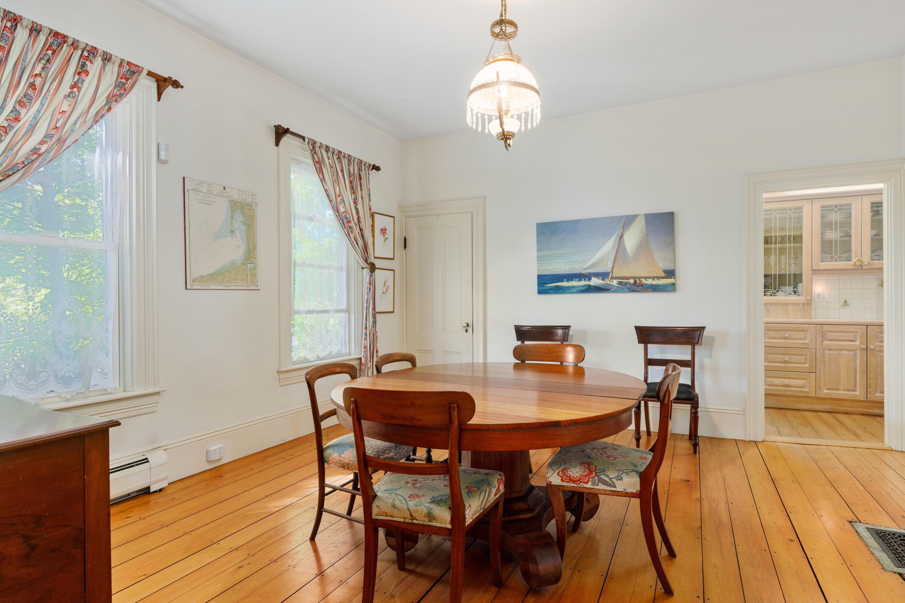 276 Main Street Wellfleet, MA 02667 - Photo 6 of 69 a view of a dining room with furniture and wooden floor