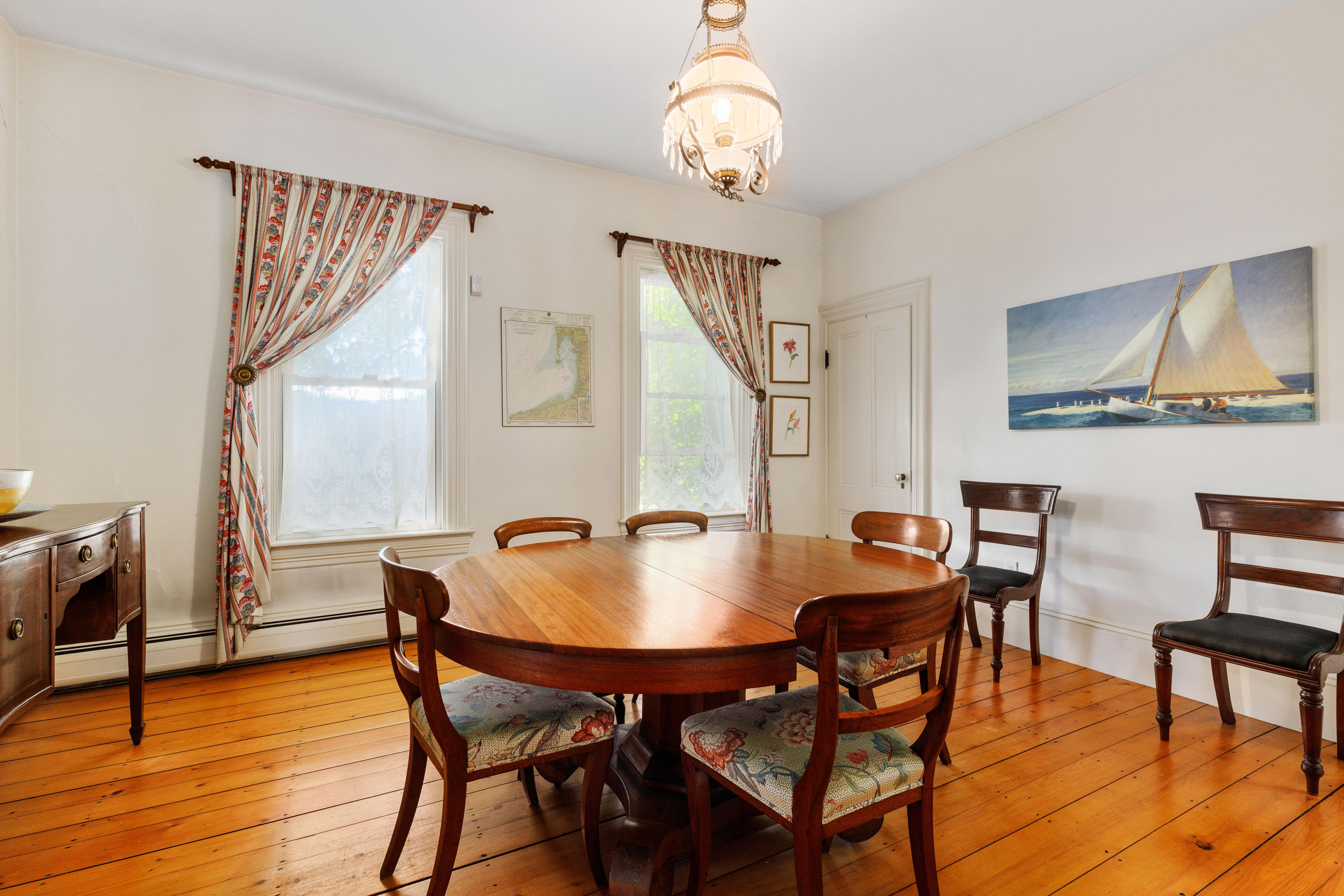 276 Main Street Wellfleet, MA 02667 - Photo 7 of 69 a view of a dining room with furniture and wooden floor