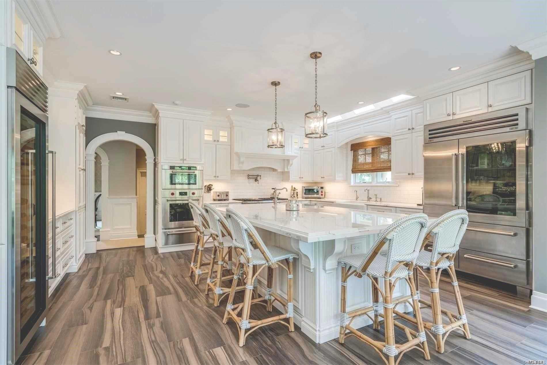 29 Fox Hunt Lane Cold Spring Harbor, NY 11724 - Photo 1 of 1 a view of a dining room with furniture window and wooden floor