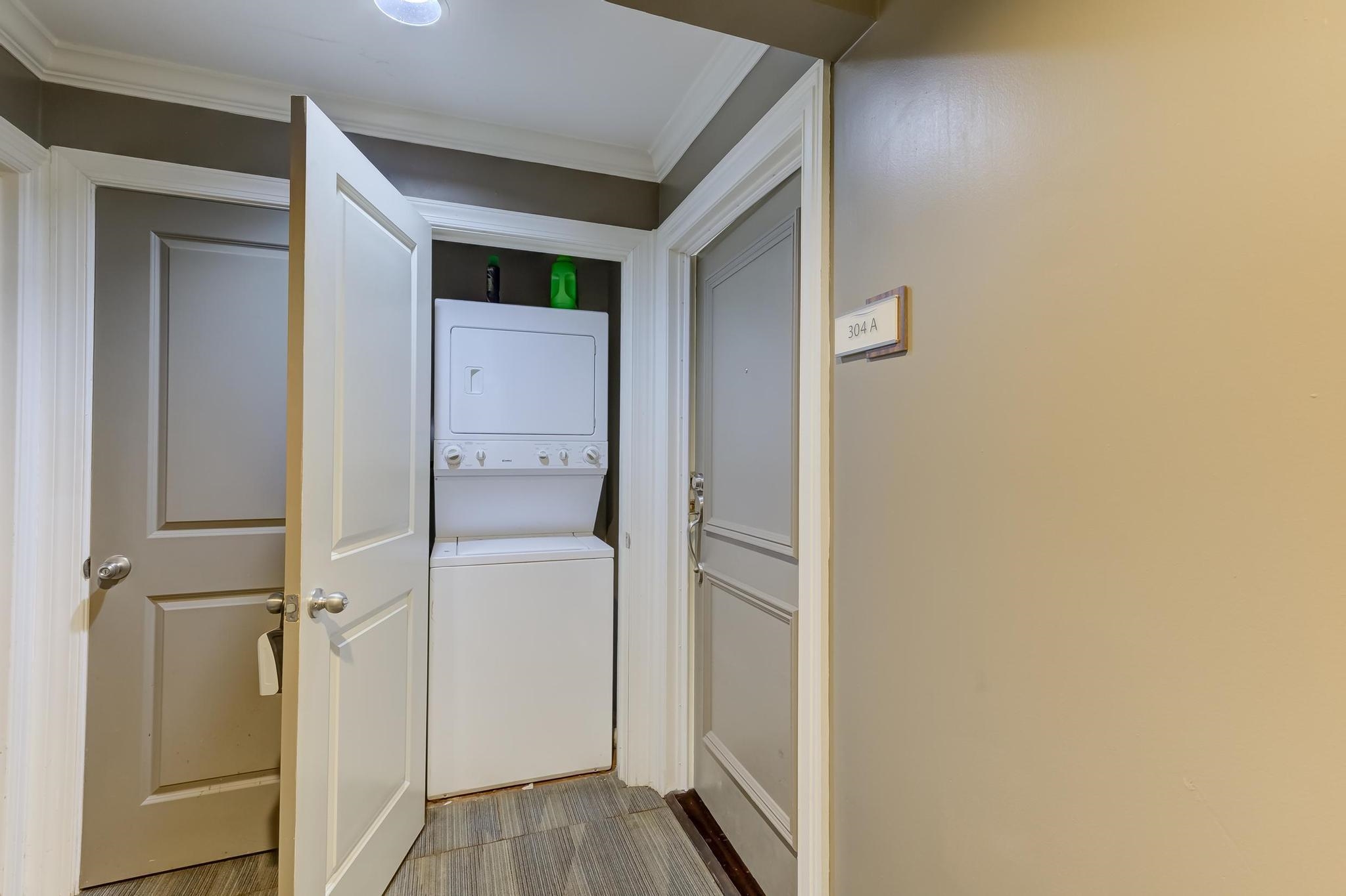 655 Riverside Drive, Unit 304A Memphis, TN 38103 - Photo 26 of 27 a view of a hallway with closet and wooden floor