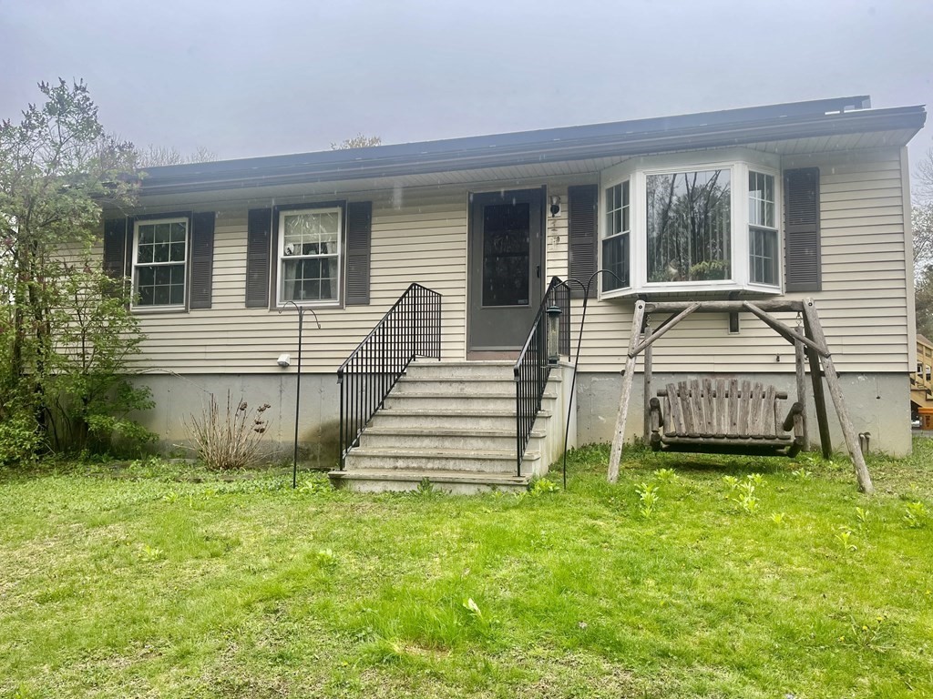 30 Podunk Road Sturbridge, MA 01566 - Photo 1 of 13 front view of a house with a yard
