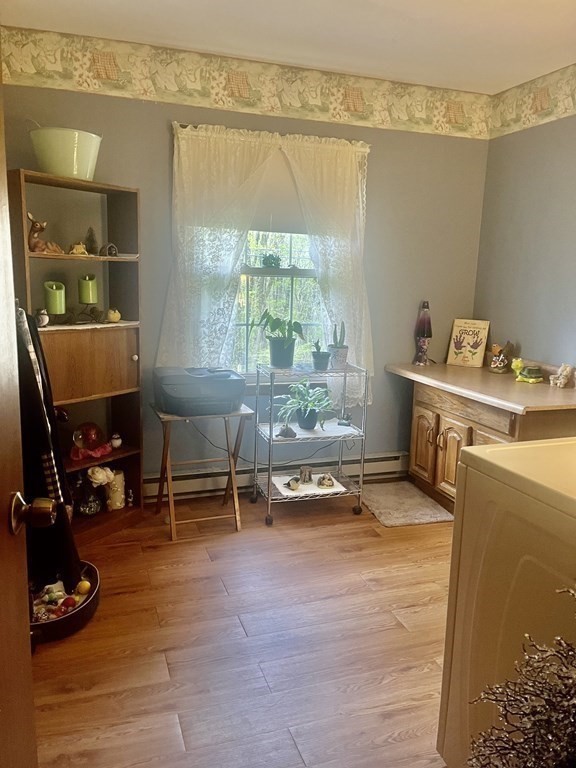 30 Podunk Road Sturbridge, MA 01566 - Photo 4 of 13 a living room with a table chair and a window