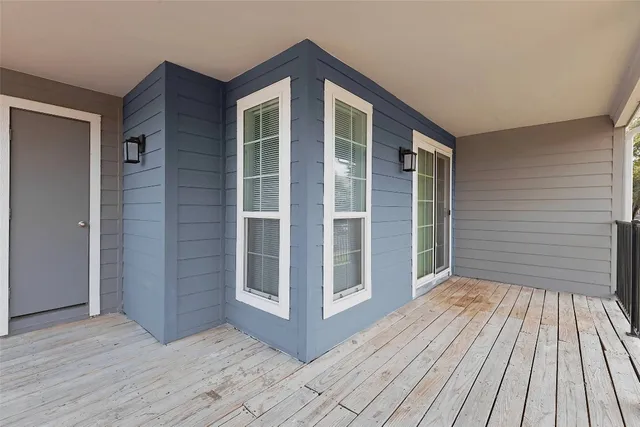 a dining room with a wooden table and chairs