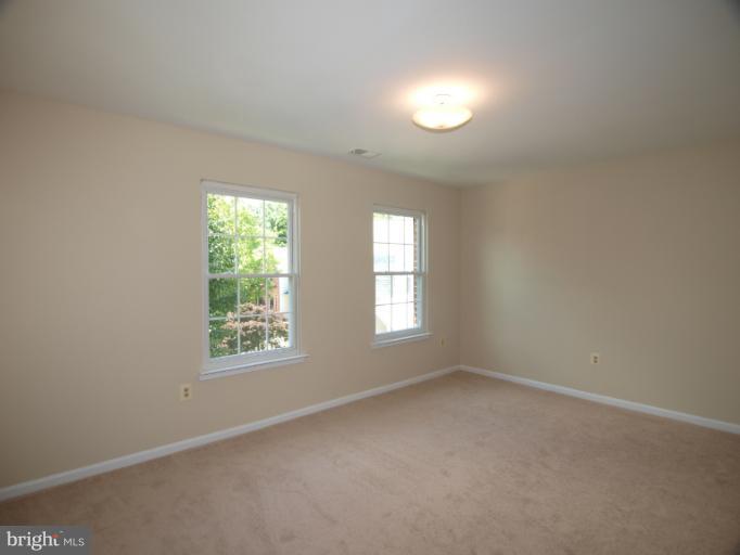 1167 Kersey Road Silver Spring, MD 20902 - Photo 14 of 25 an empty room with windows