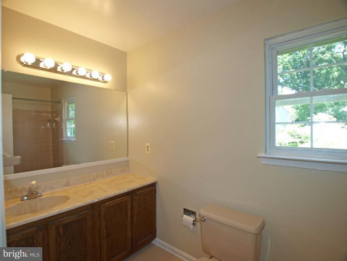 1167 Kersey Road Silver Spring, MD 20902 - Photo 16 of 25 a bathroom with a sink and a mirror