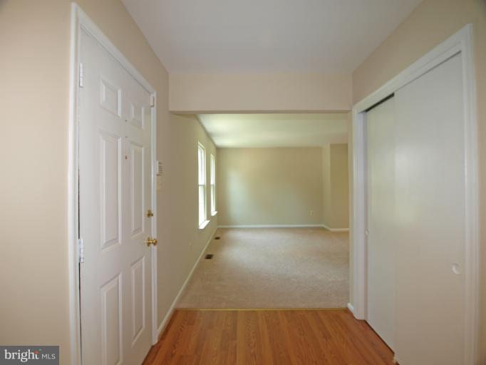 1167 Kersey Road Silver Spring, MD 20902 - Photo 3 of 25 a view of a room with wooden floor and a bathroom