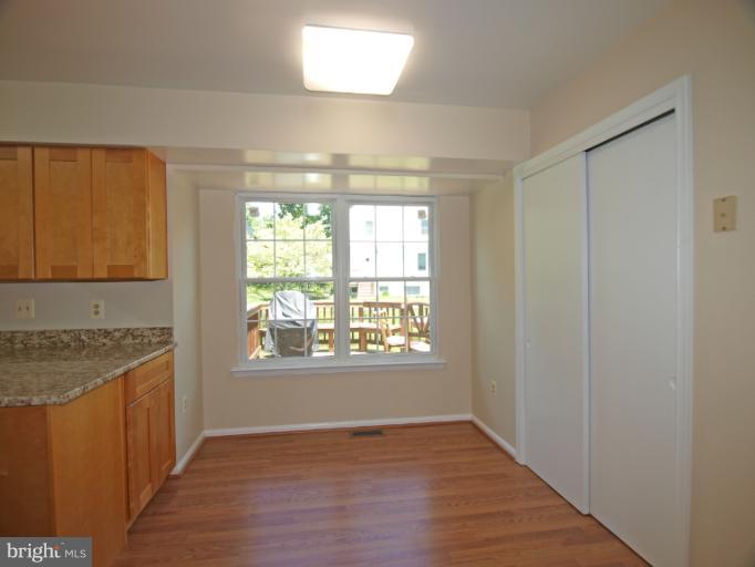 1167 Kersey Road Silver Spring, MD 20902 - Photo 9 of 25 an empty room with wooden floor and windows