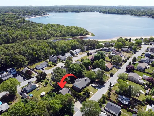 an aerial view of a houses with lake view