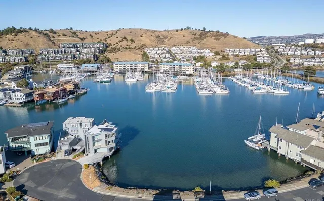 an aerial view of a house with a lake view