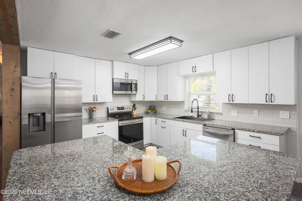a bathroom with a sink toilet and a mirror