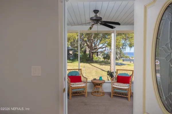 a view of entryway with wooden floor and stairs