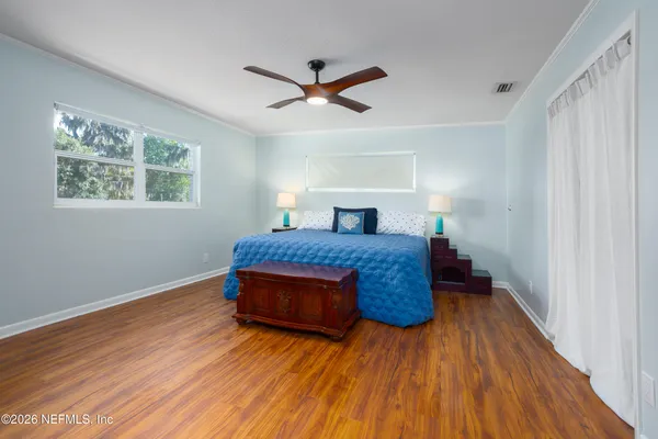 a bathroom with a sink mirror and toilet
